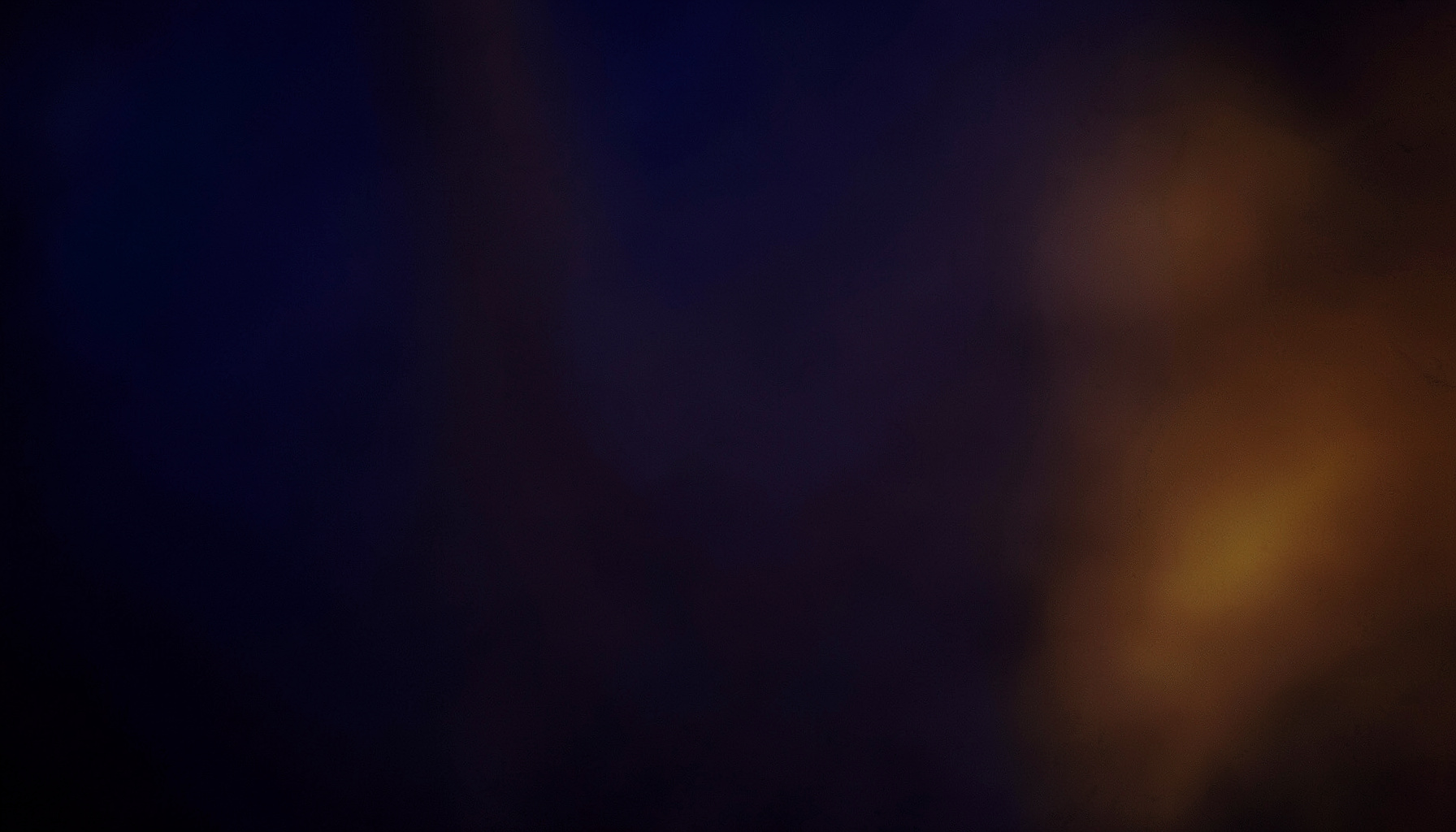A warm, atmospheric stage-lit composition in deep indigo and amber, suggesting the energy of a live drum performance