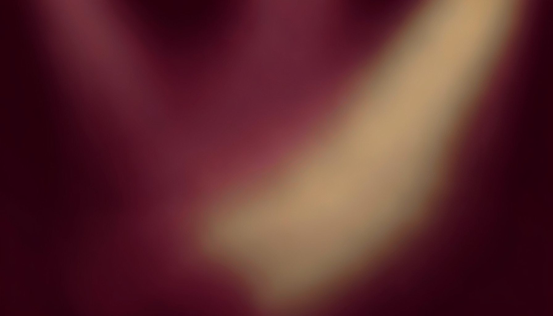 Warm abstract gradient composition in deep burgundy and muted gold tones, evoking stage lighting and musical atmosphere